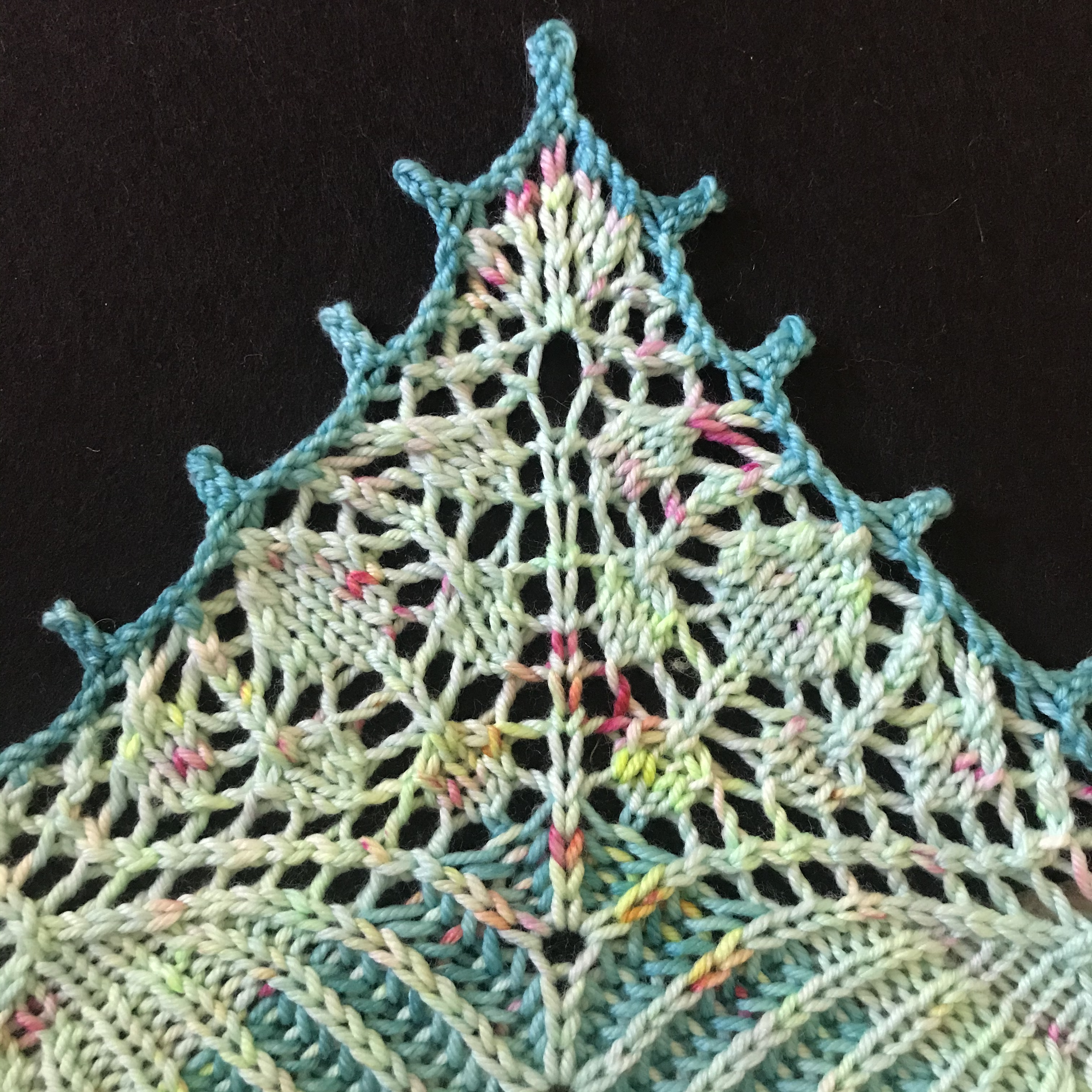 Close up of the middle point of the second lace section of the Carillon shawl